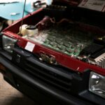 close up of car components under hood